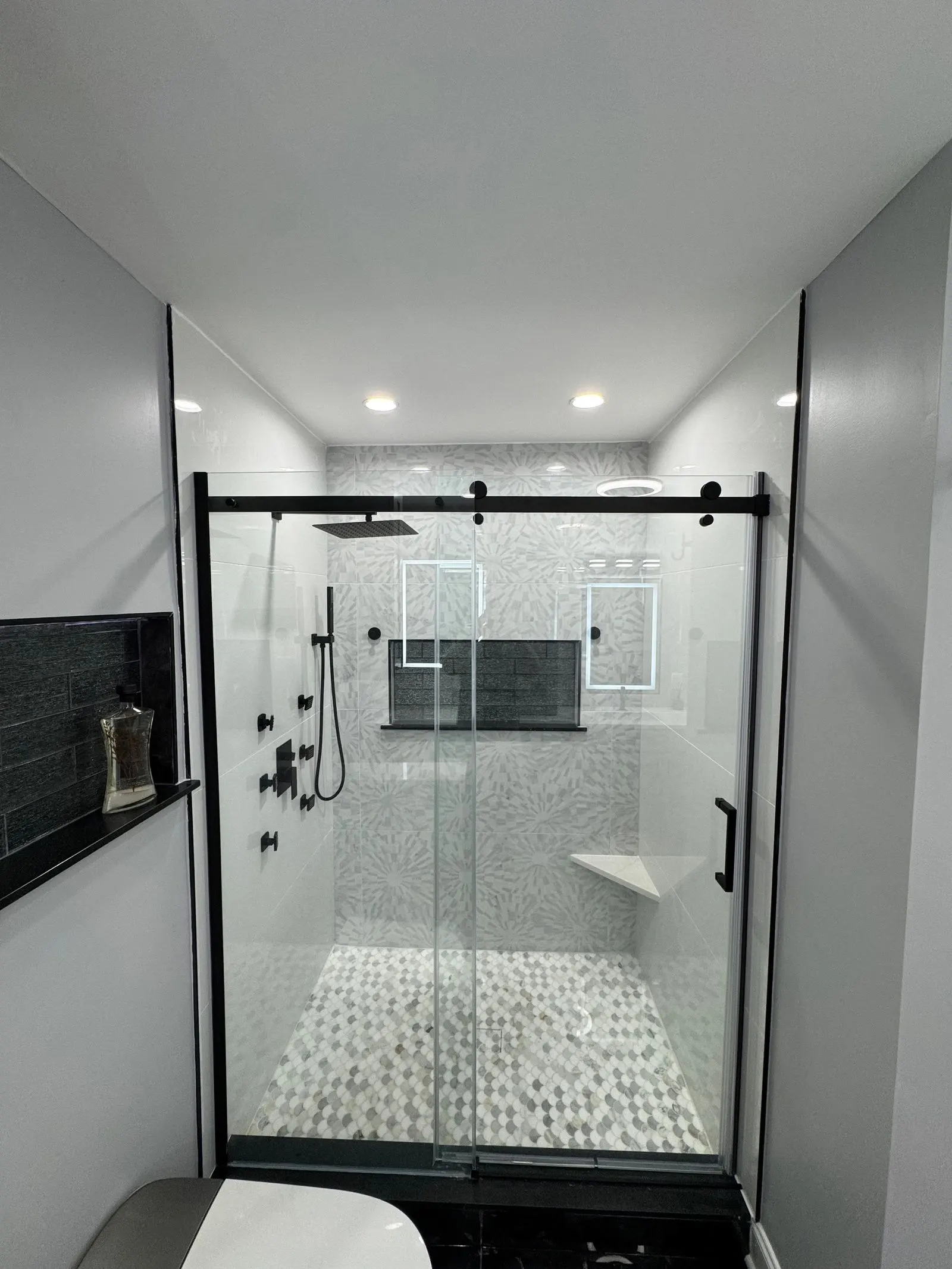 Glass shower with matte black fixtures